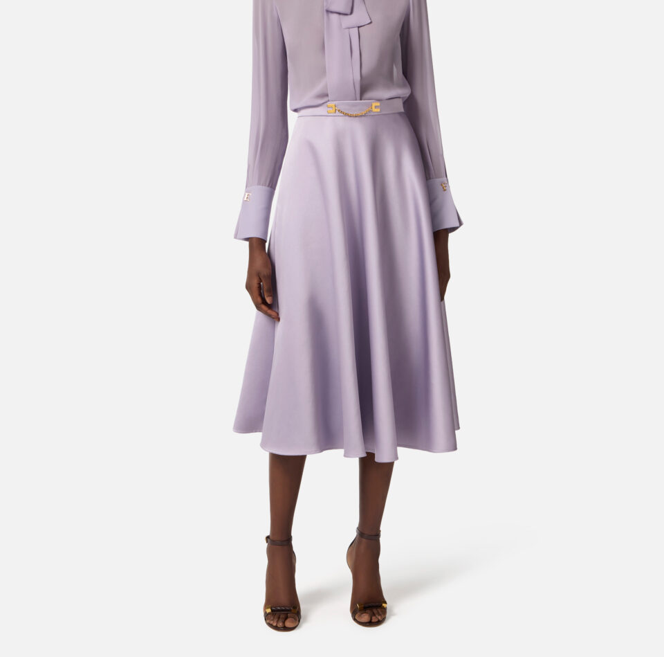 Gonna in duchesse con logo gioiello